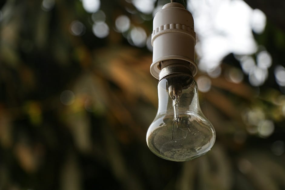 a drop of water falling into a glass bottle